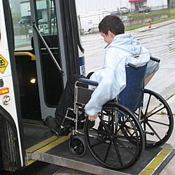 Person in wheelchair boarding bus